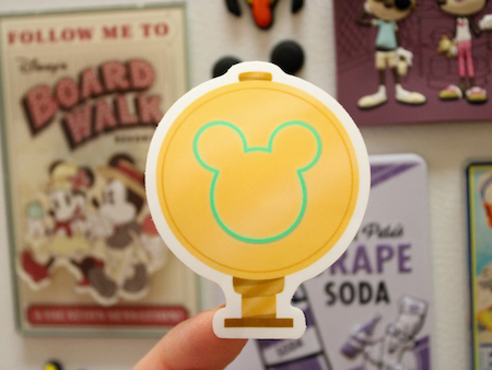 Mickey Mouse stickers for Disney adults featuring the Magic Kingdom MagicBand scanner in gold.